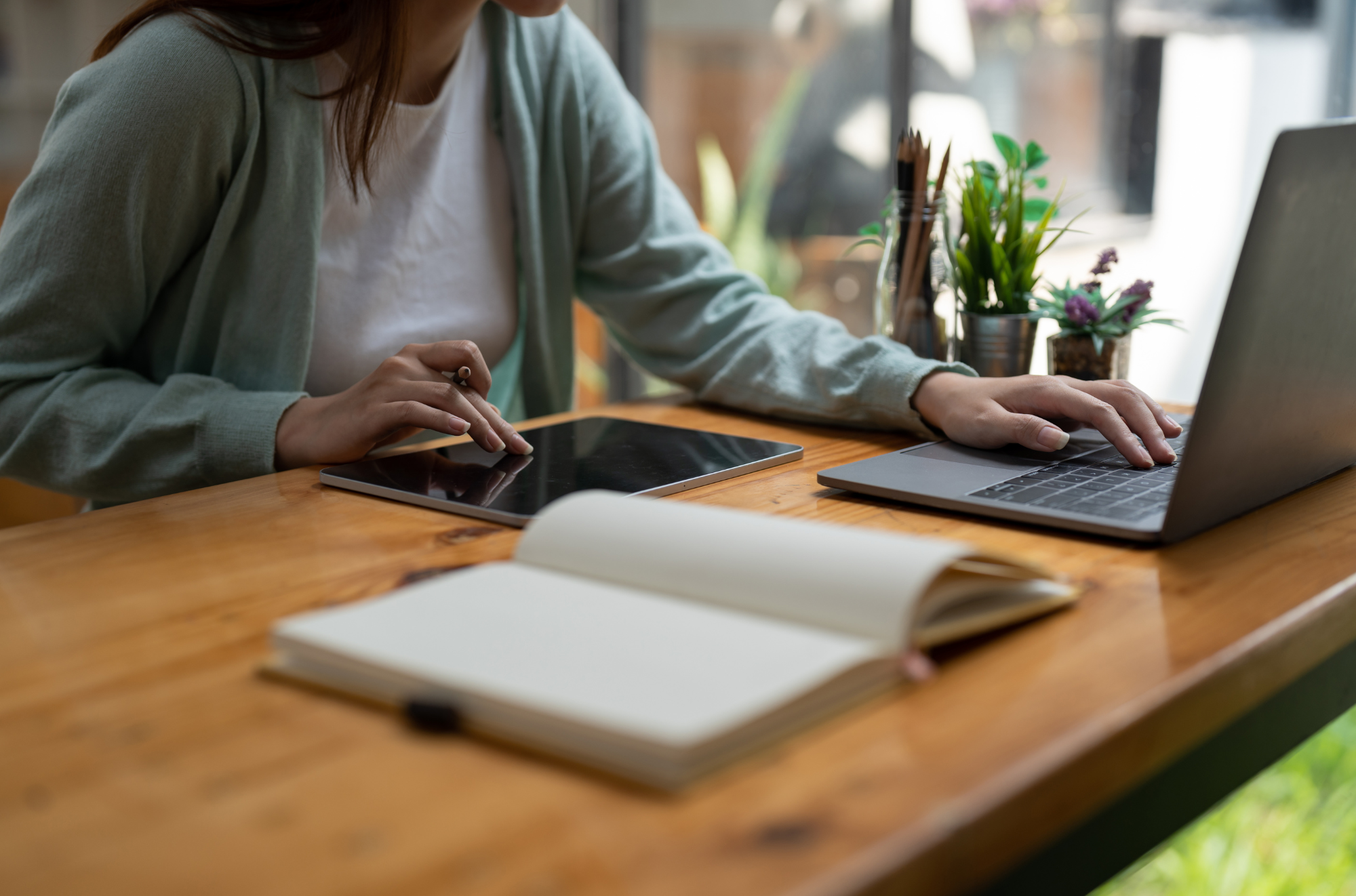Woman on laptop taking notes