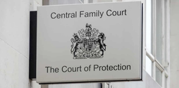 A sign on a building for the Central Family Court, the Court of Protecion.