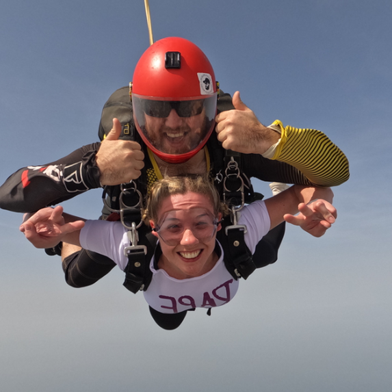 Woman and a man mid-air doing a sky dive to raise money for Rape Crisis England & Wales