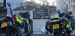 Two police motorbikes parked up outside New Scotland Yard